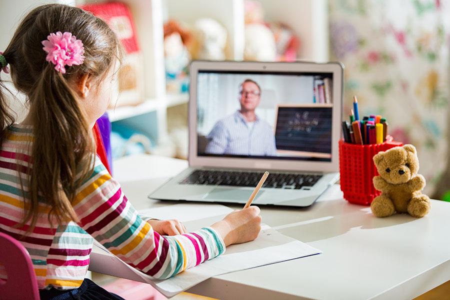 Middle-aged distance teacher having video conference call with p